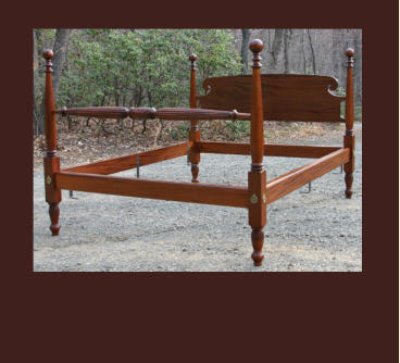 hand carved cannon ball bed in mahogany with quilt rail and scrolled headboard